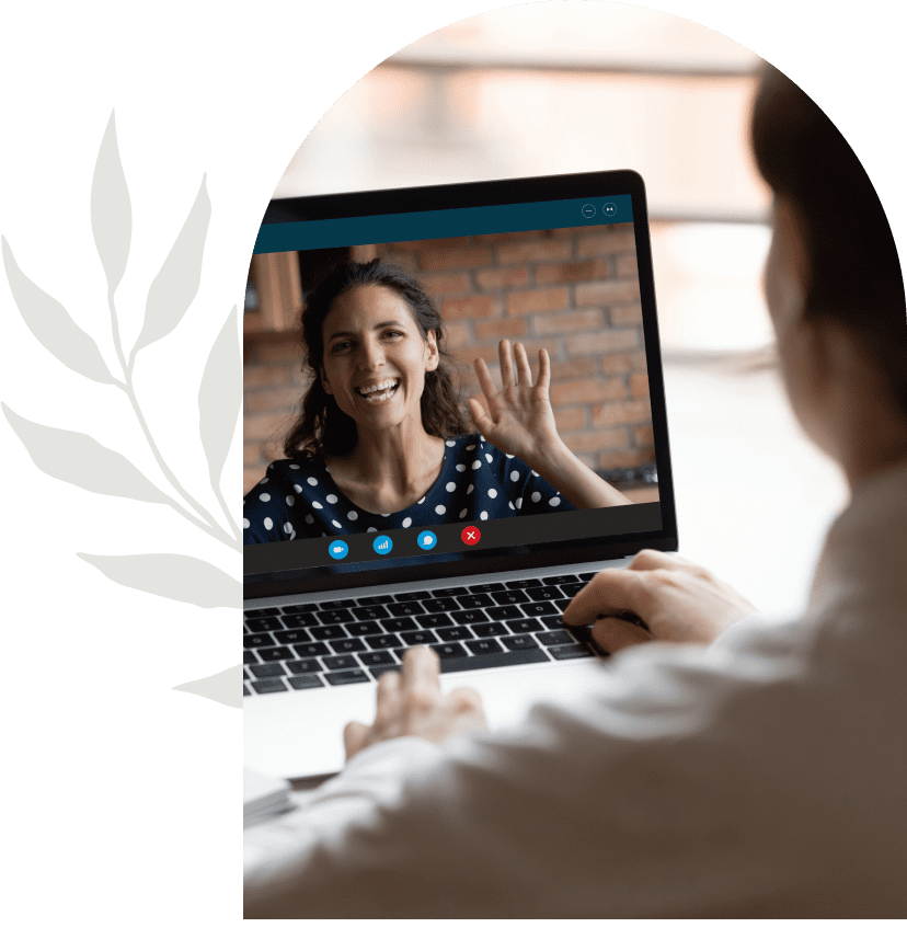 Person video chatting with a woman on a laptop screen.
